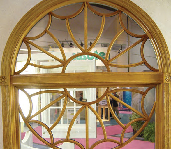 Curved wood grille with a custom decorative pattern